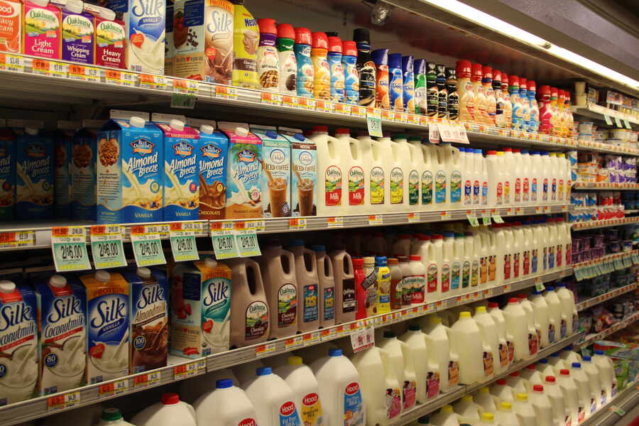 Five shelves of various dairy products.